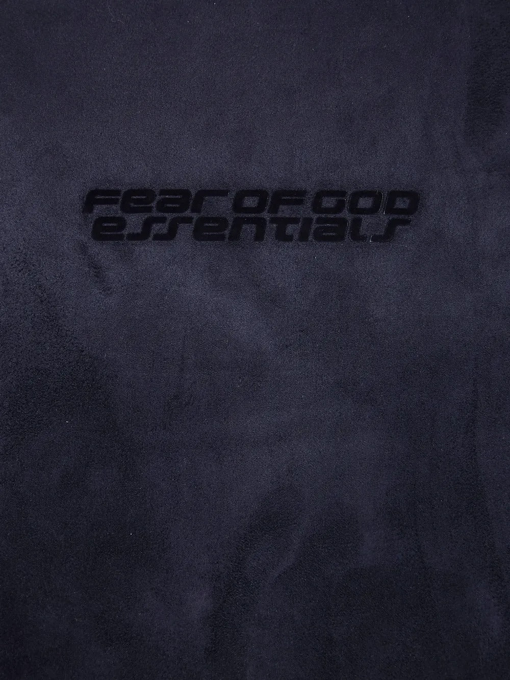 Close up of blue hoodie, showing texture of the fabric