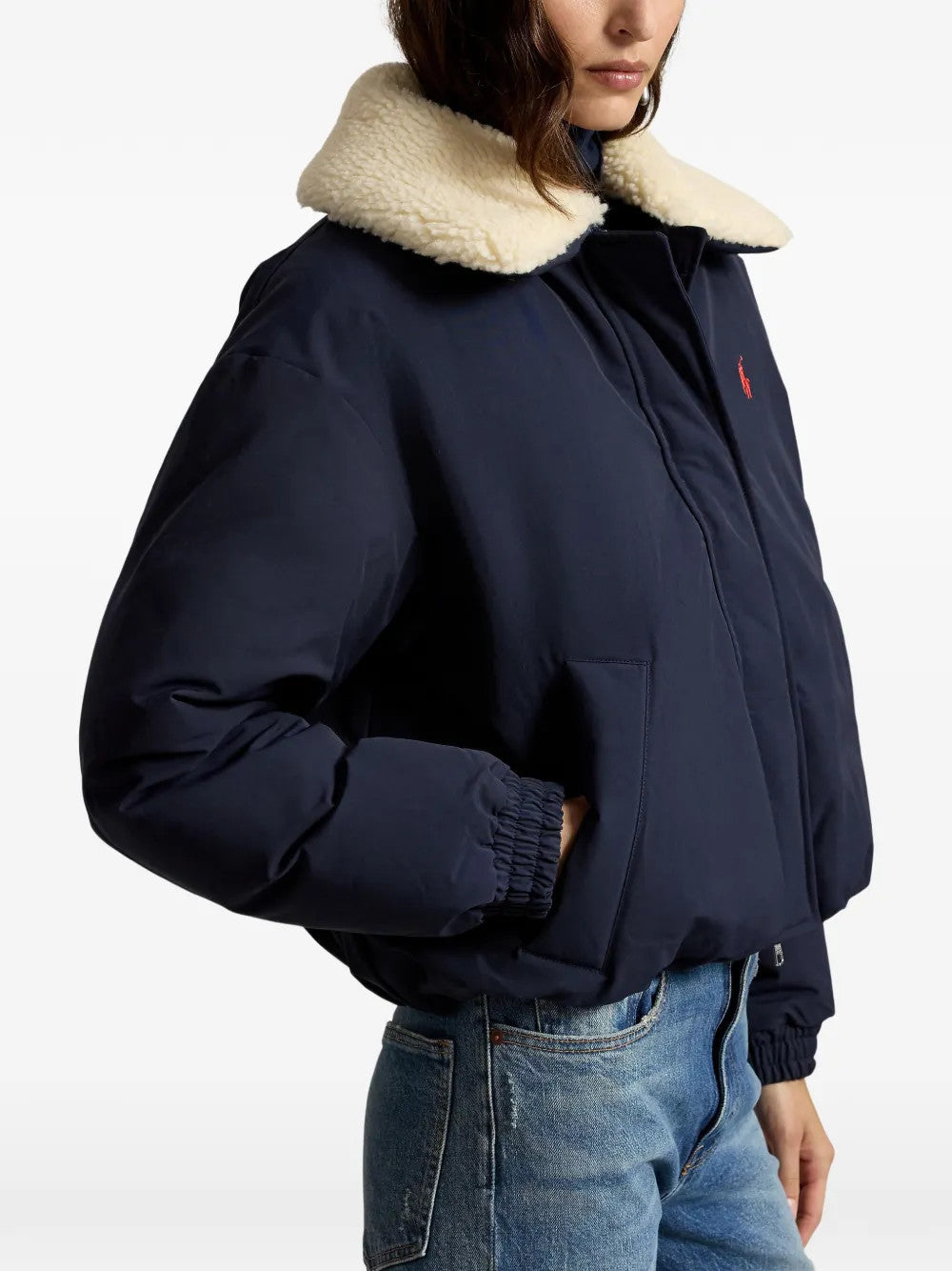 Navy jacket worn by a person, showing the jacket fit