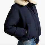 Navy jacket worn by a person, showing the jacket fit