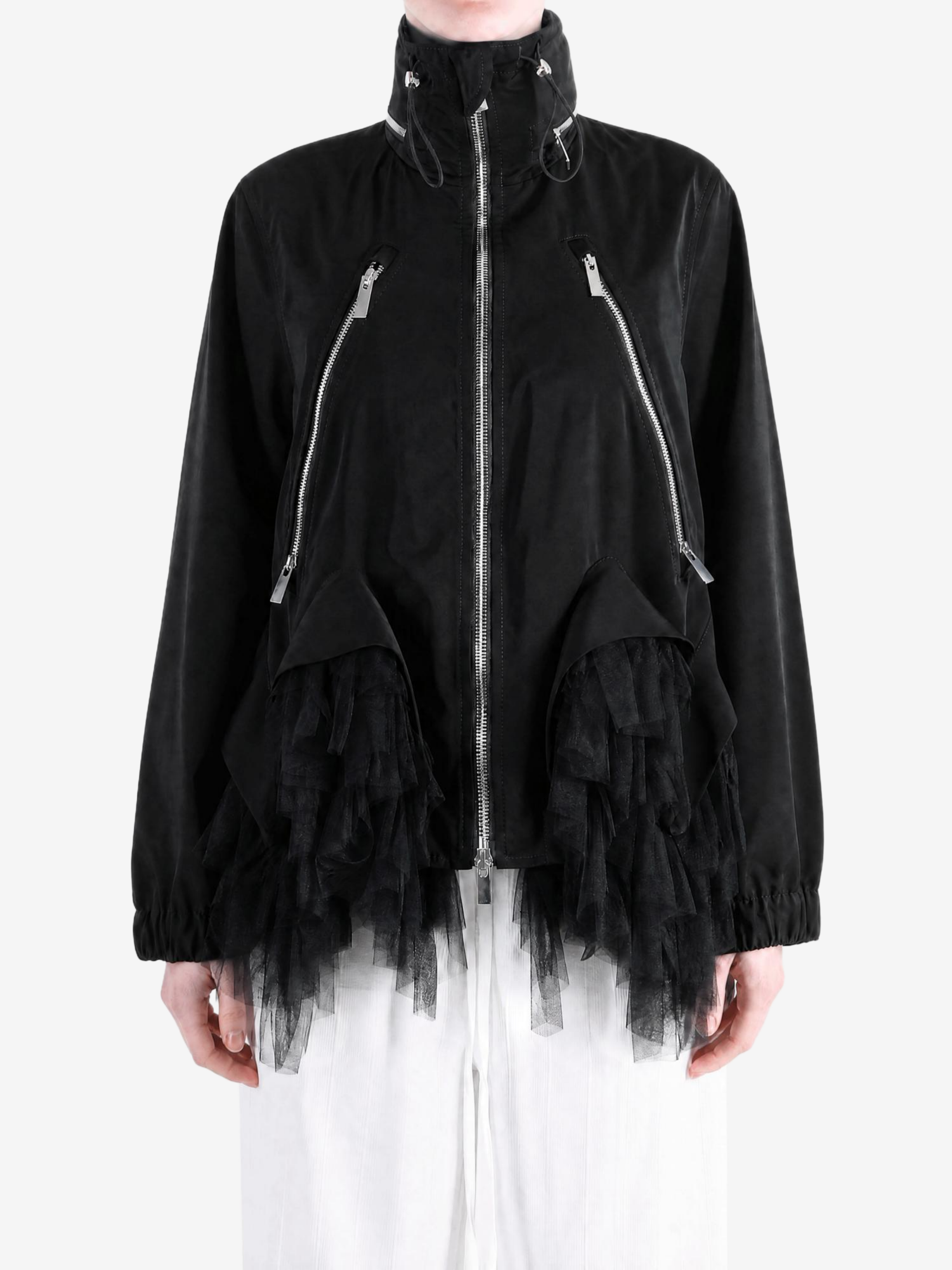 Black jacket worn by a person, showing the jacket fit