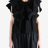 Black blouse worn by a person, showing the blouse's fit