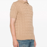 Tan knitwear worn by a person, showing the knitwear fit