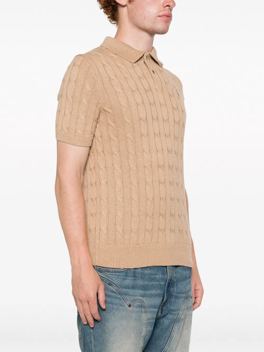 Tan knitwear worn by a person, showing the knitwear fit