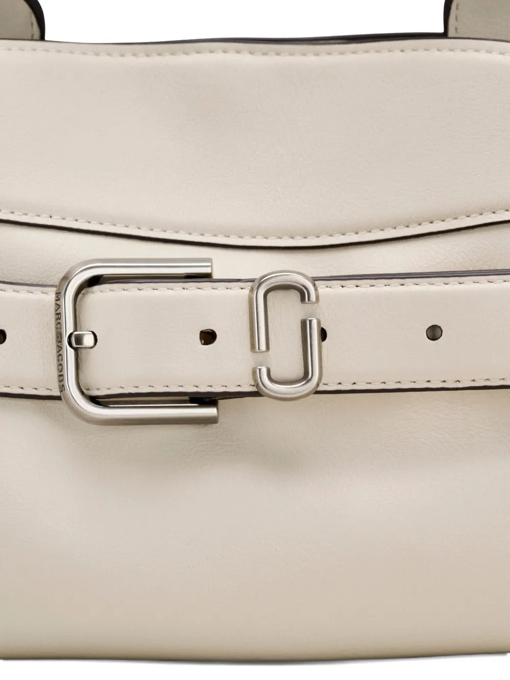 Close up of the white bag, showing texture of the leather fabric