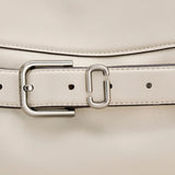 Close up of the white bag, showing texture of the leather fabric