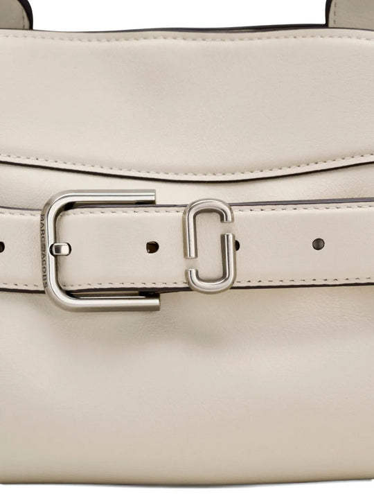 Close up of the white bag, showing texture of the leather fabric