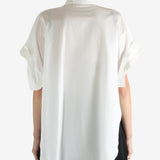 White shirts worn by a person, showing the shirts fit