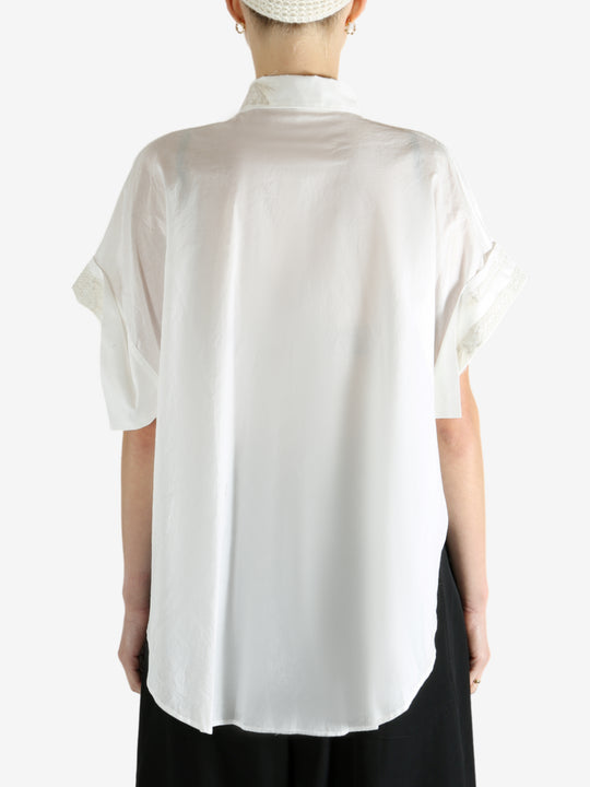 White shirts worn by a person, showing the shirts fit