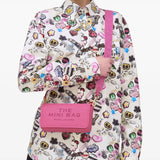 Pink bag worn by a person, showing the bag's fit