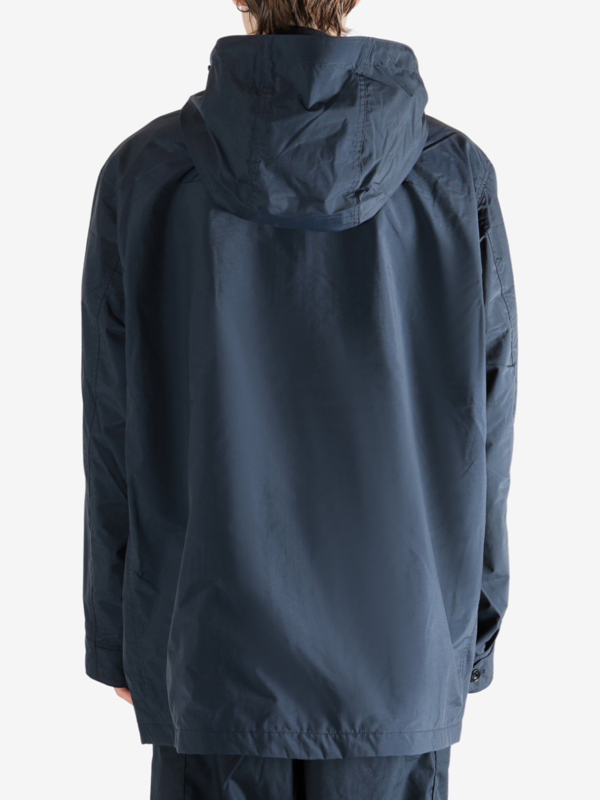 Navy jacket worn by a person, showing the jacket's fit