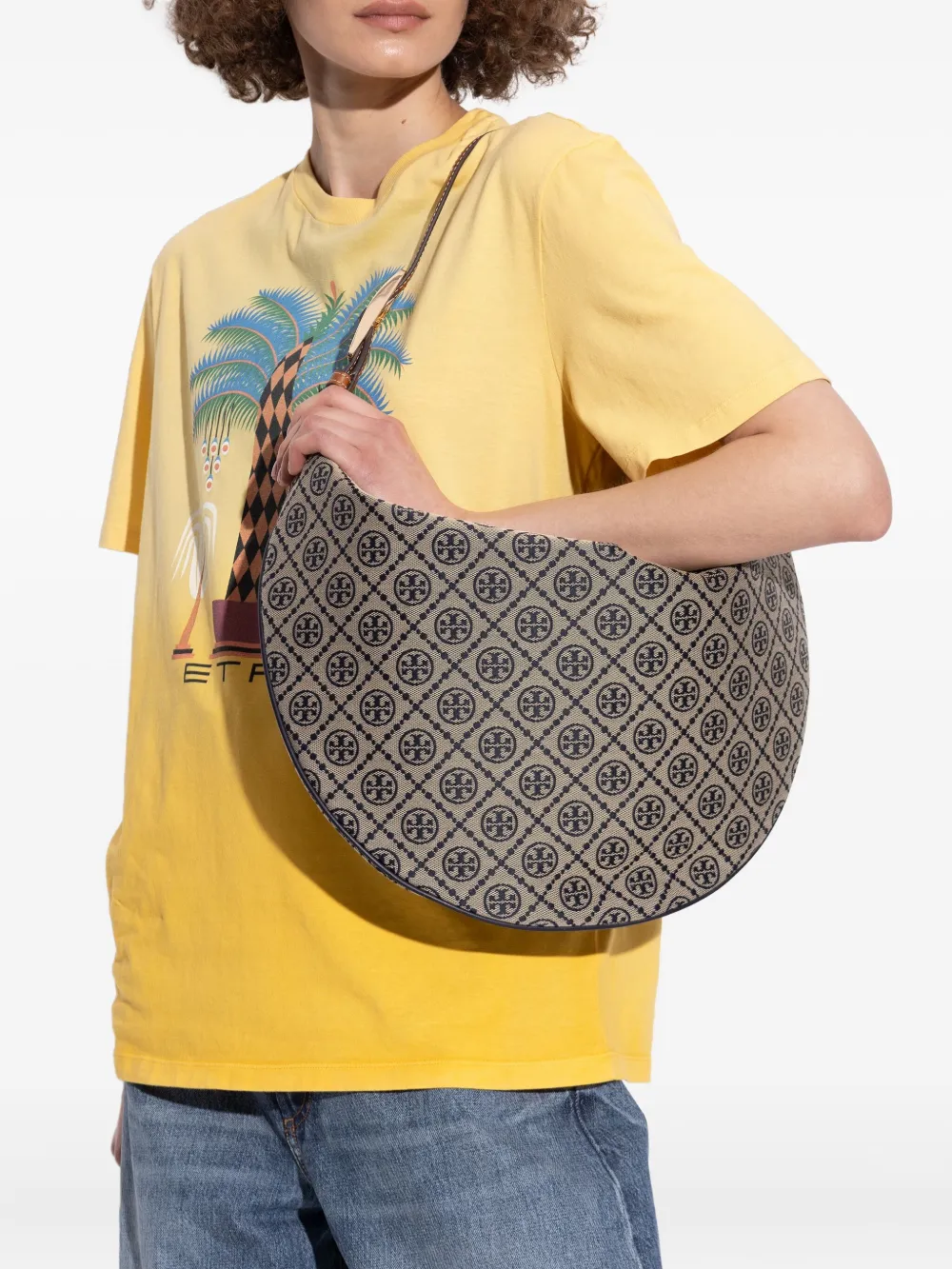 Navy bag worn by a person, showing the bag's fit