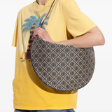 Navy bag worn by a person, showing the bag's fit