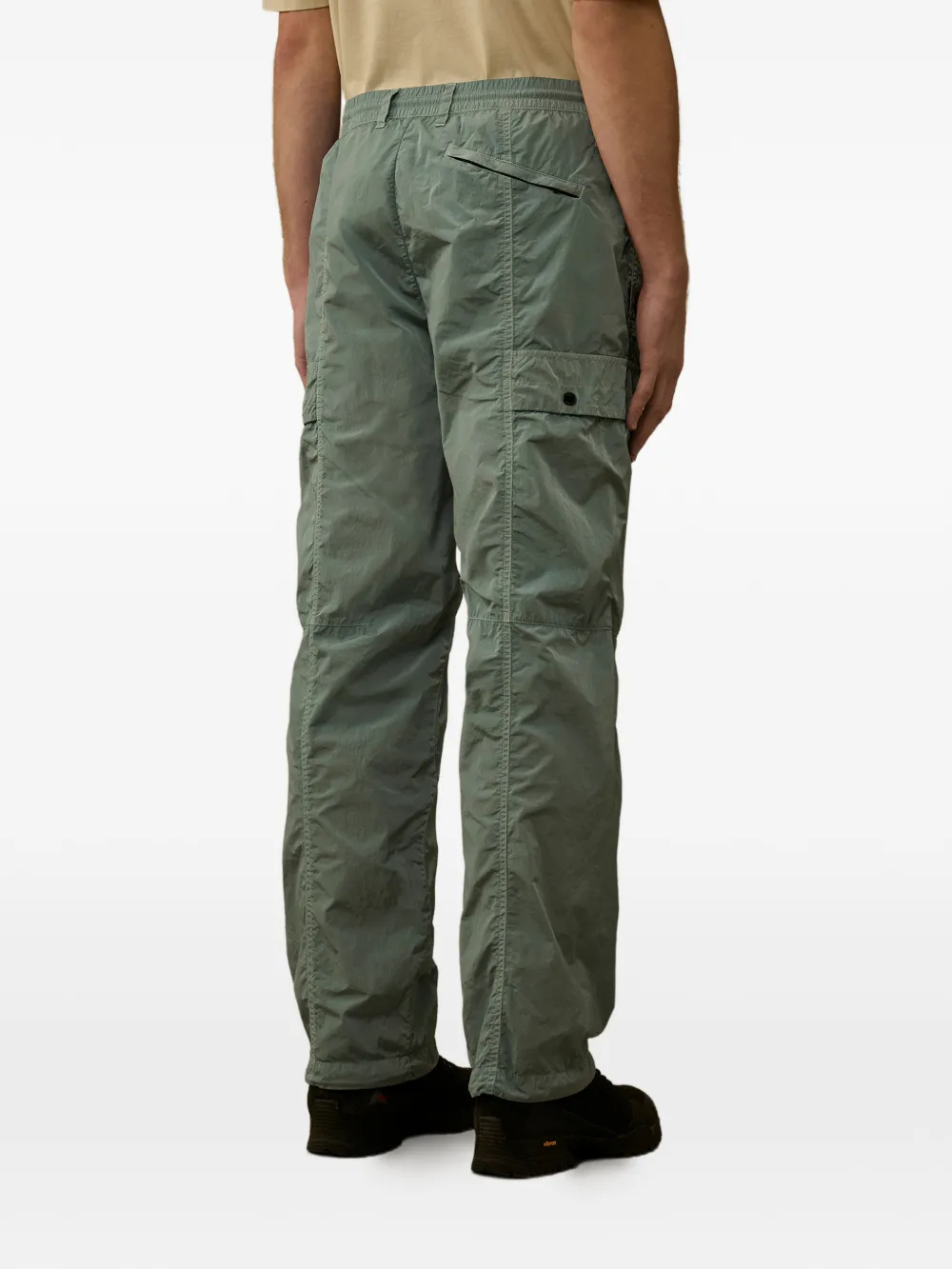 green pants worn by a person, showing the pants fit