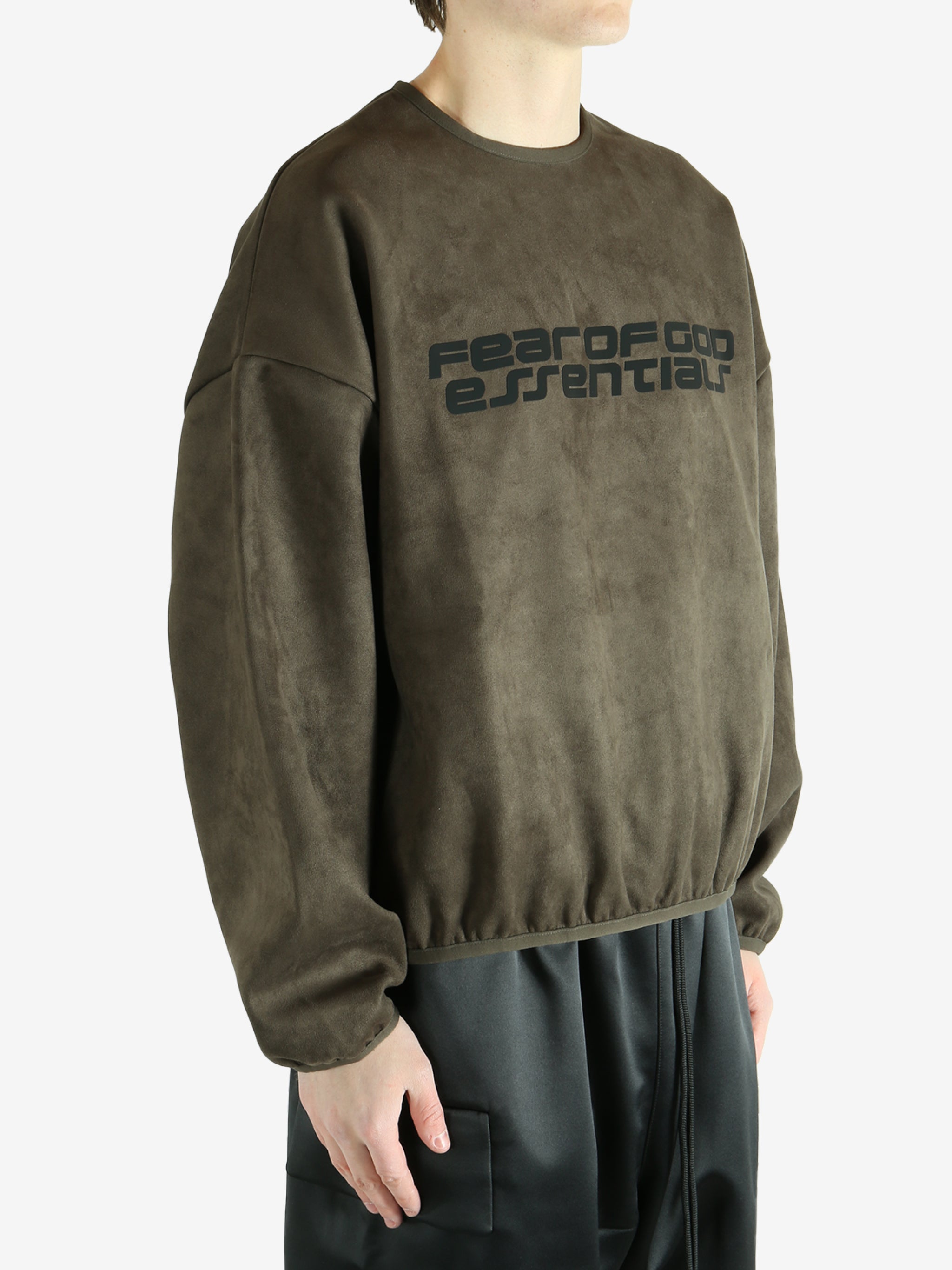 Brown sweatshirt worn by a person, showing the sweatshirt's fit
