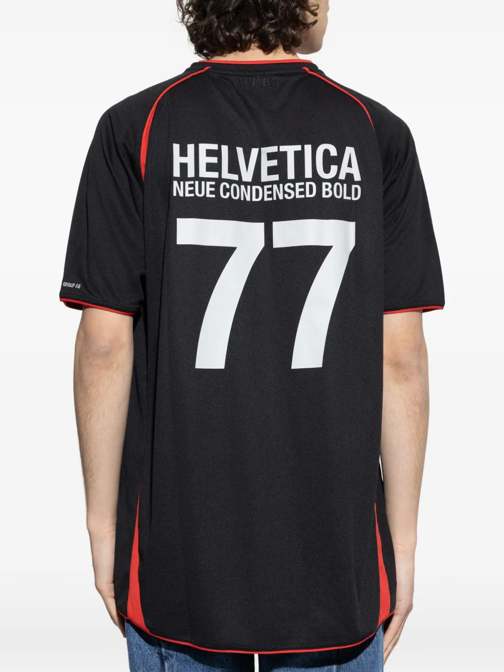 Black t-shirt, worn by a person, showing the t-shirt fit