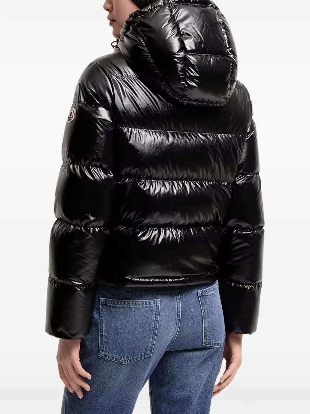Black jacket worn by a person, showing the jacket fit
