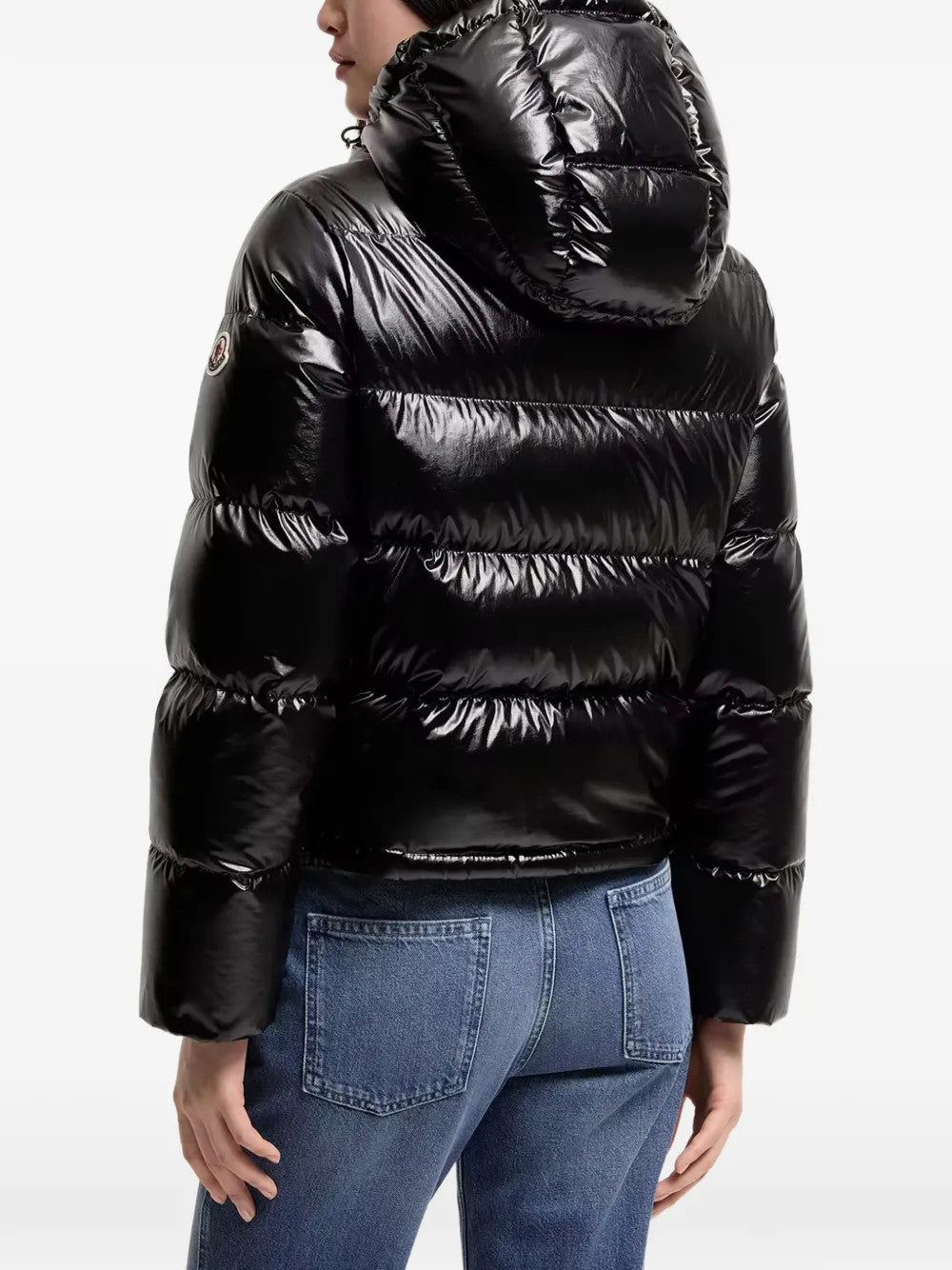 Black jacket worn by a person, showing the jacket fit