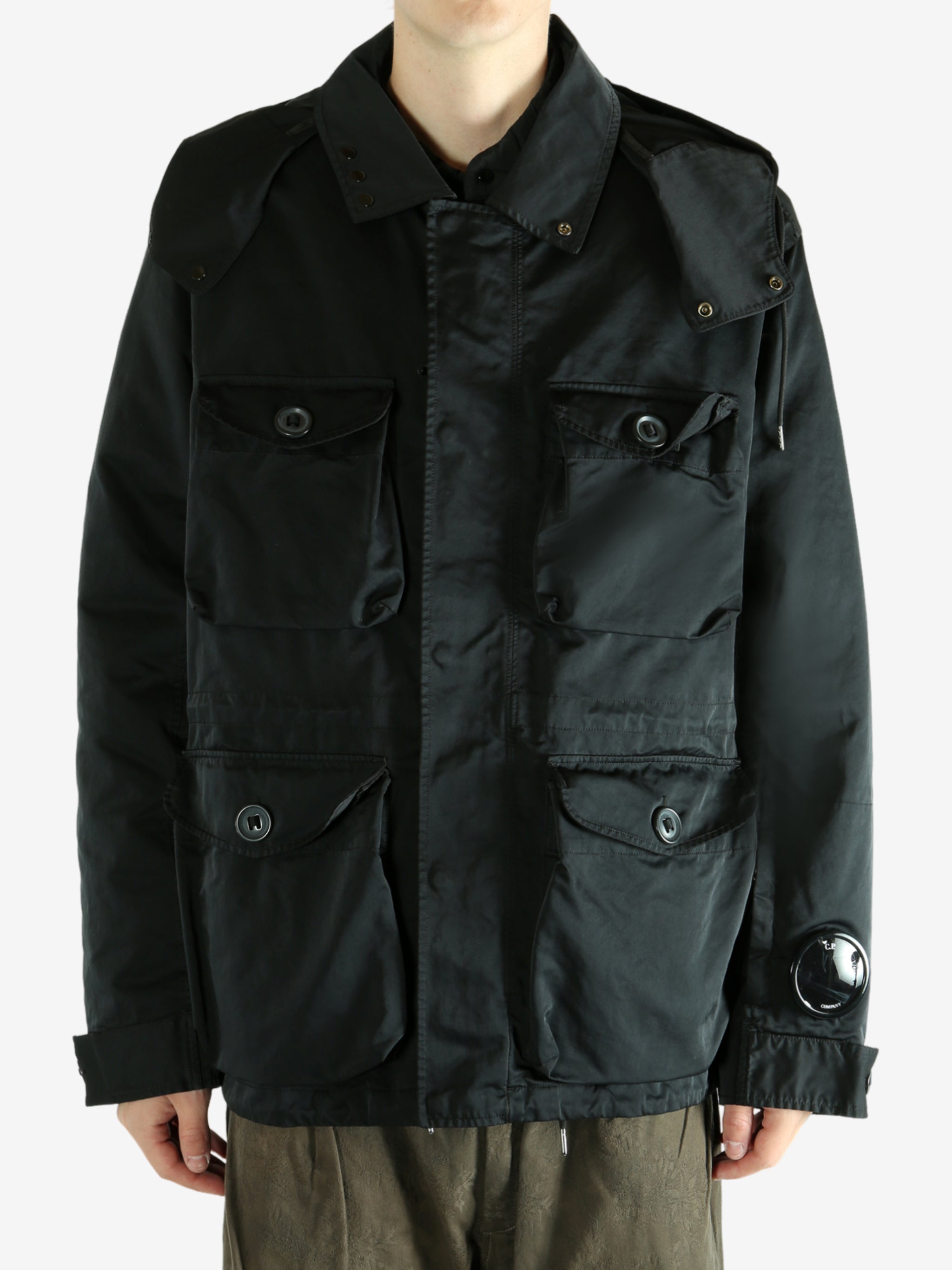 Black jacket worn by a person, showing the jacket's fit