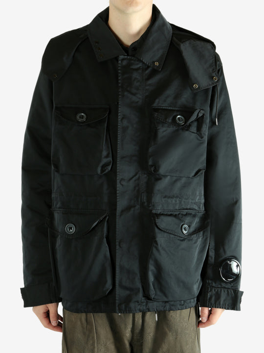 Black jacket worn by a person, showing the jacket's fit