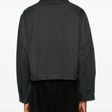 Black jacket  worn by a person, showing the jacket 's fit