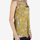 Yellow top worn by a person, showing the top's fit