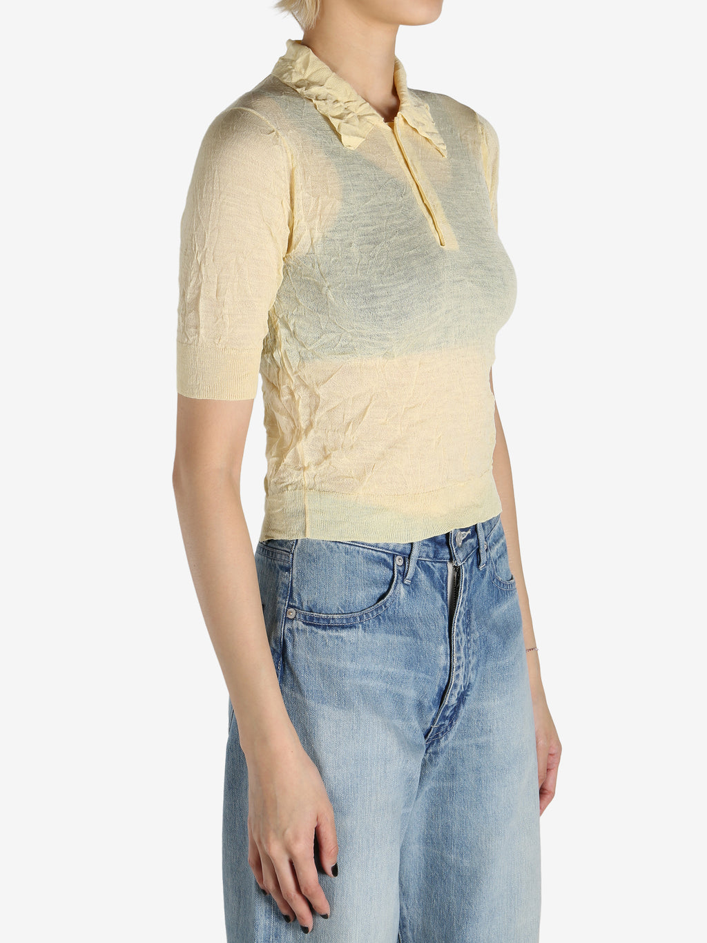 Yellow shirt worn by a person, showing the shirt's fit