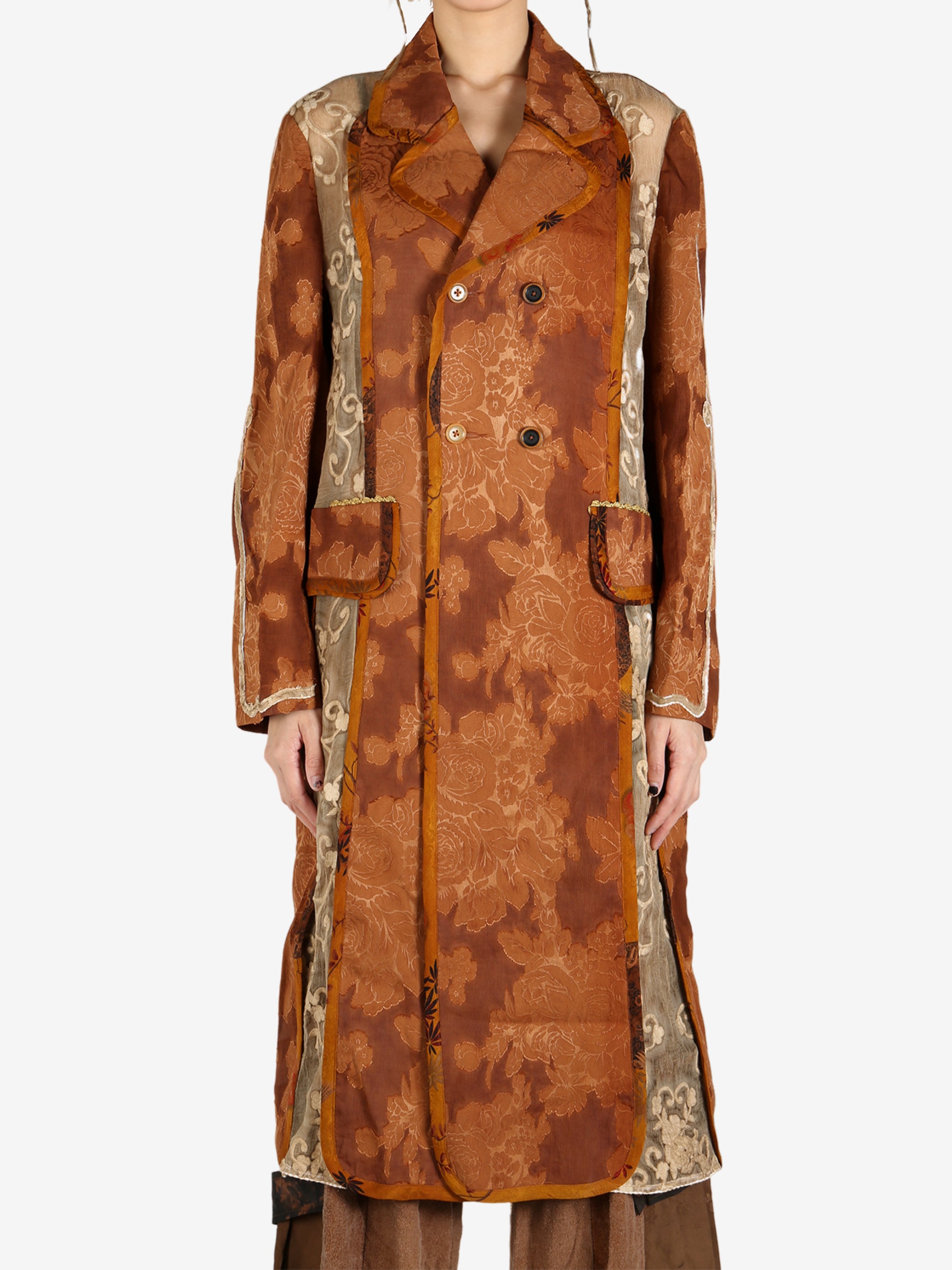 Orange coat worn by a person, showing the coat’s fit