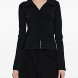Black top worn by a person, showing the top's fit