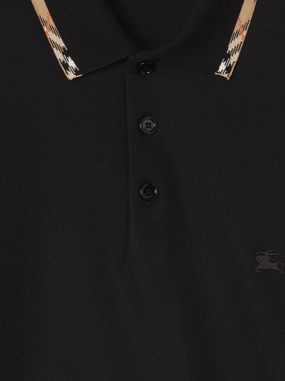 Close up of Black t-shirt, showing texture of the cotton fabric