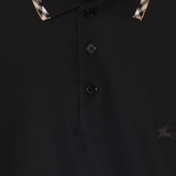 Close up of Black t-shirt, showing texture of the cotton fabric