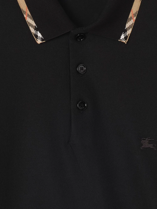 Close up of Black t-shirt, showing texture of the cotton fabric