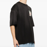 Black t-shirt worn by a person, showing the t-shirt's fit