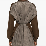 Brown knitwear worn by a person, showing the knitwear fit