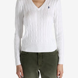White knitwear worn by a person, showing the knitwear's fit