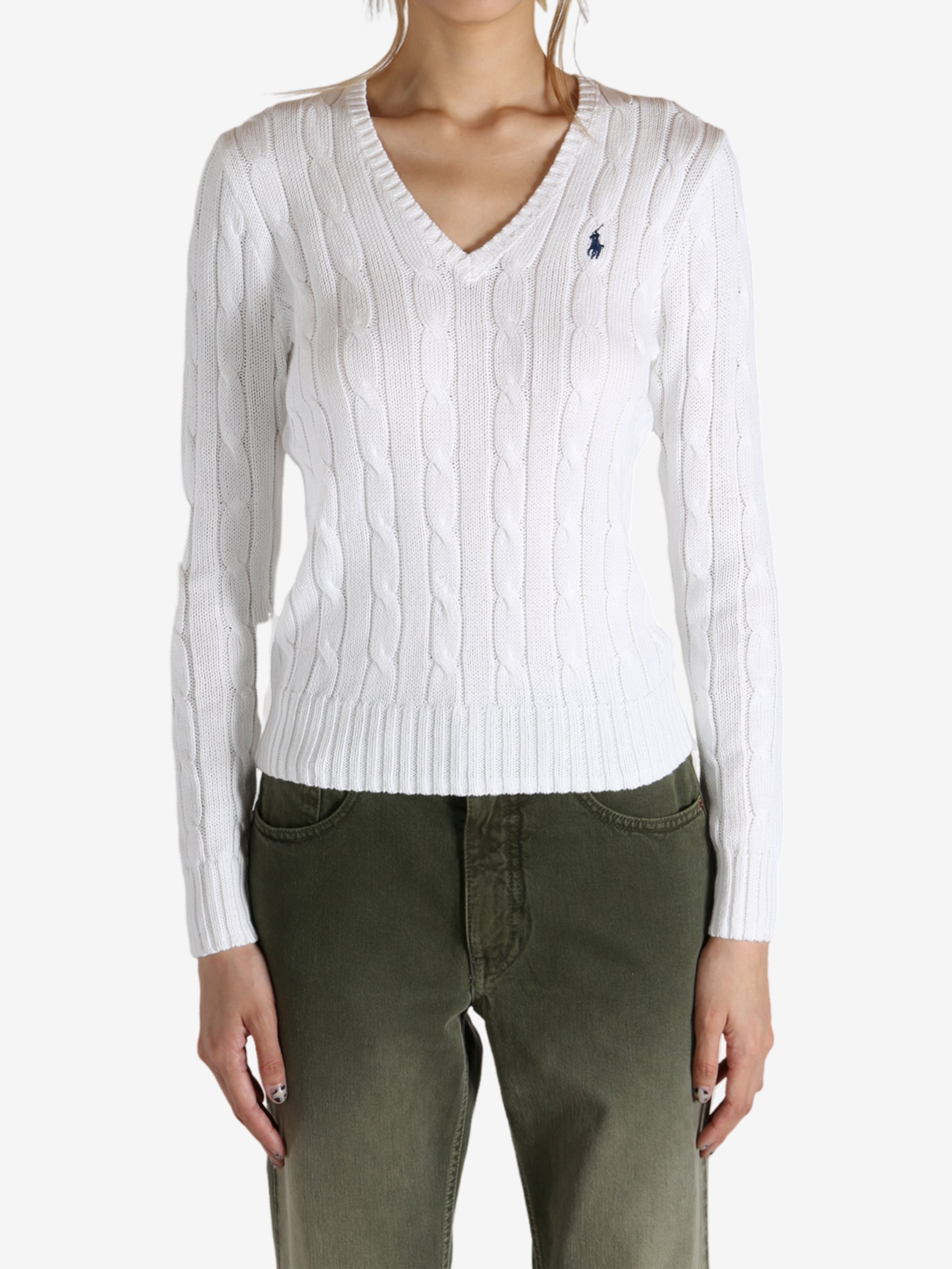 White knitwear worn by a person, showing the knitwear's fit