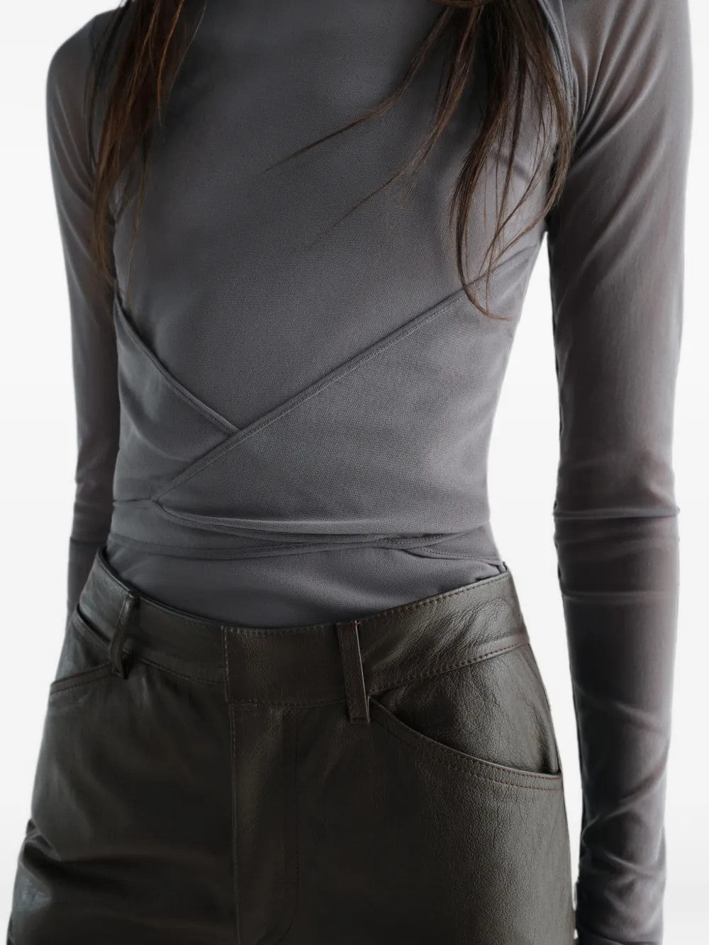 Grey top worn by a person, showing the top fit