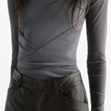 Grey top worn by a person, showing the top fit