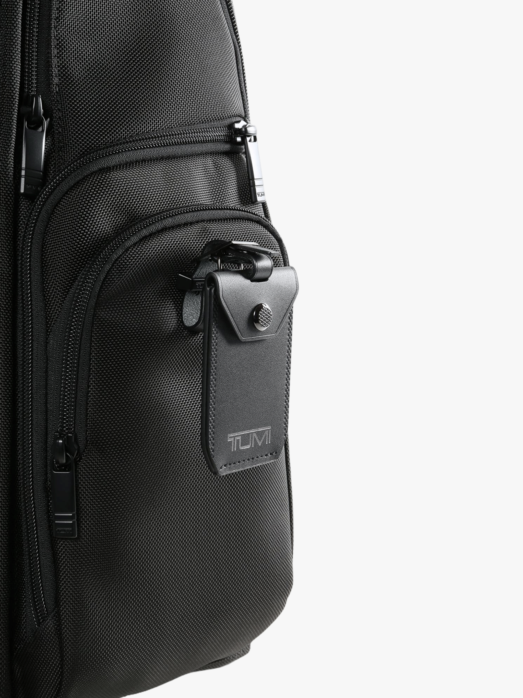 Close up of black backpack, showing texture of the nylon fabric