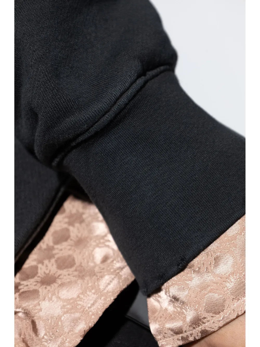 Close up of Black t-shirt, showing texture of the 100% cotton fabric