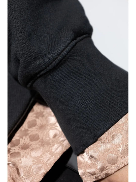 Close up of Black t-shirt, showing texture of the 100% cotton fabric