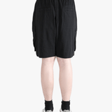 Black shorts worn by a person, showing the shorts fit
