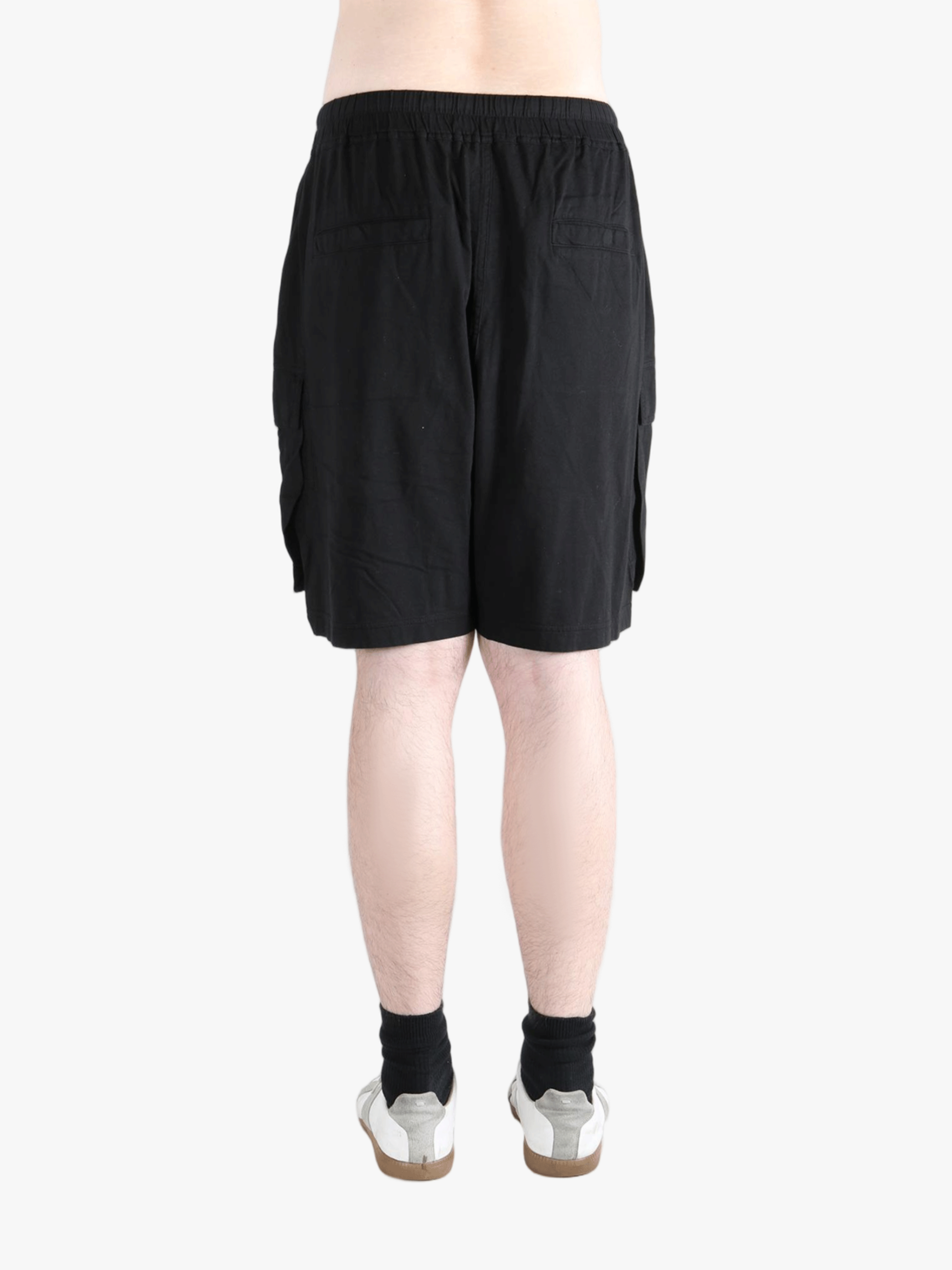 Black shorts worn by a person, showing the shorts fit