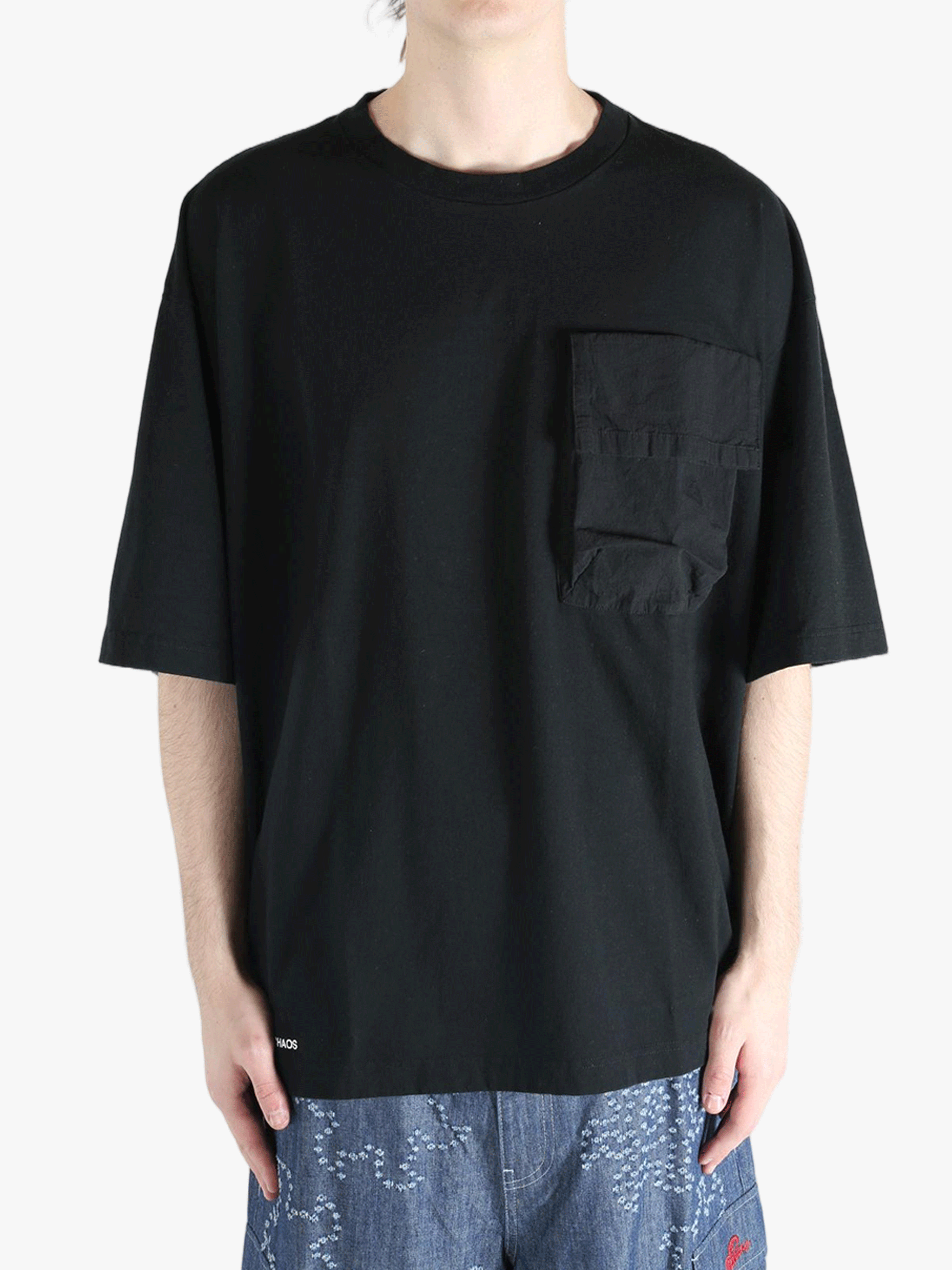 Black t-shirt worn by a person, showing the shirt's fit