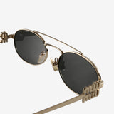 Close up of the grey sunglasses, showing texture of the metal fabric