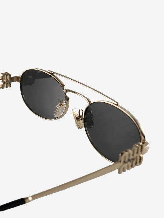 Close up of the grey sunglasses, showing texture of the metal fabric