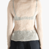 Tan shirt worn by a person, showing the shirt's fit