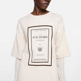 Tan t-shirt worn by a person, showing the t-shirt fit