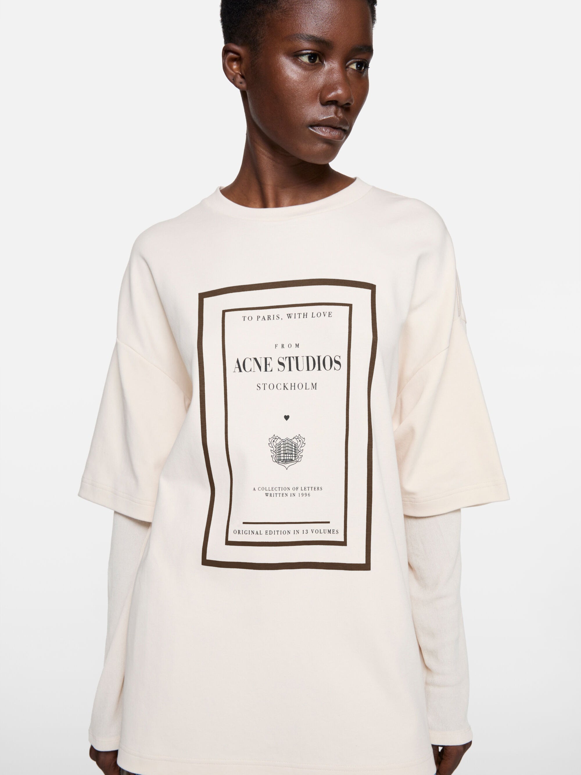 Tan t-shirt worn by a person, showing the t-shirt fit