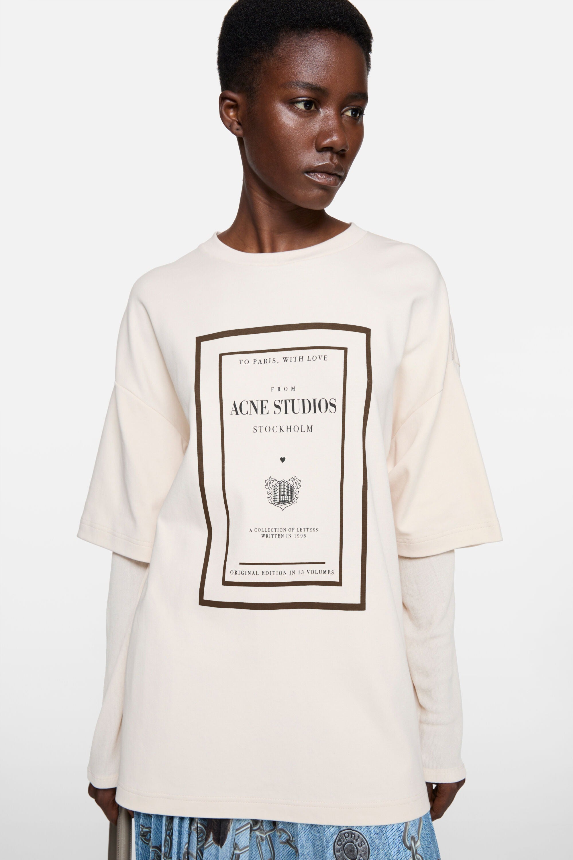 Tan t-shirt worn by a person, showing the t-shirt fit