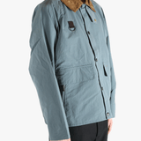 Blue jacket worn by a person, showing the jacket fit